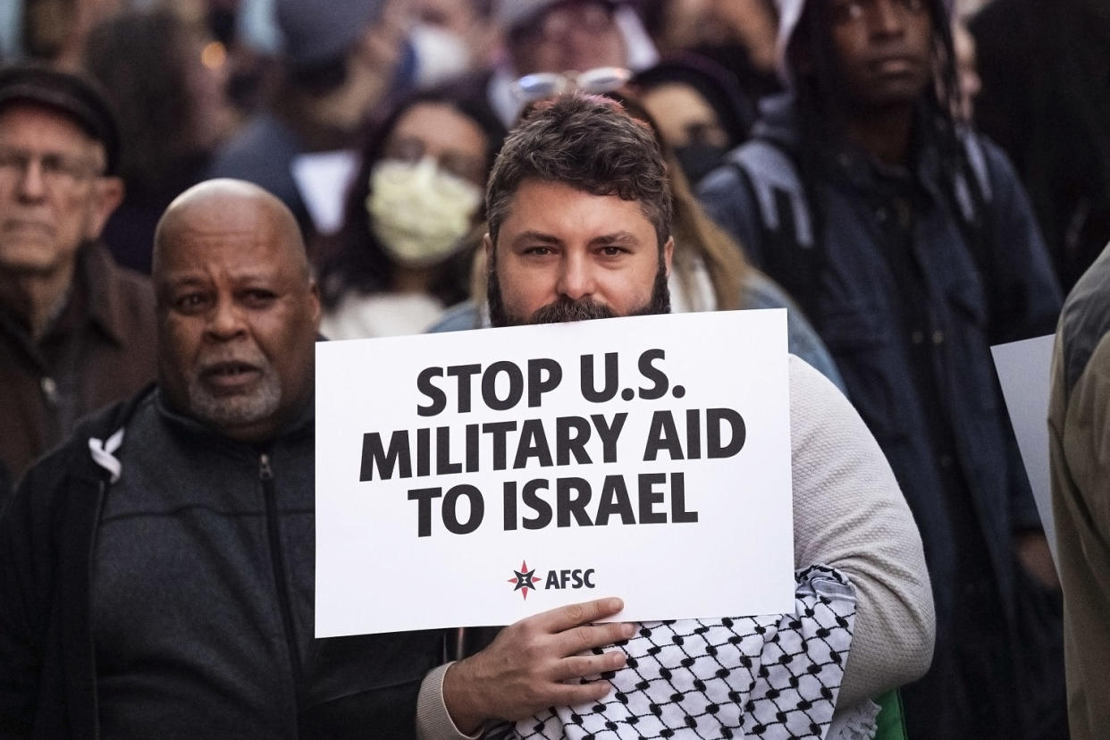 People rally outside the office of John Fetterman. (Jose F. Moreno / The Philadelphia Inquirer via AP file)