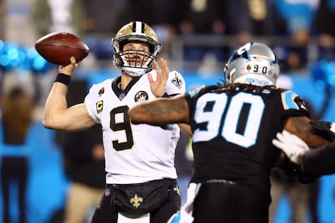 New Orleans Saints quarterback Drew Brees (9) looks to pass while under pressure by Carolina Panthers defensive end Julius Peppers (90) in the third quarter at Bank of America Stadium - Credit: Jeremy Brevard/USA TODAY