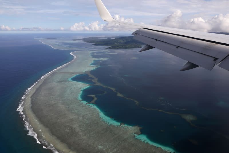 FILE PHOTO: FILE PHOTO: U.S. Secretary of State Pompeo's plane makes its landing approach on Pohnpei International Airport in Kolonia, Federated States of Micronesia