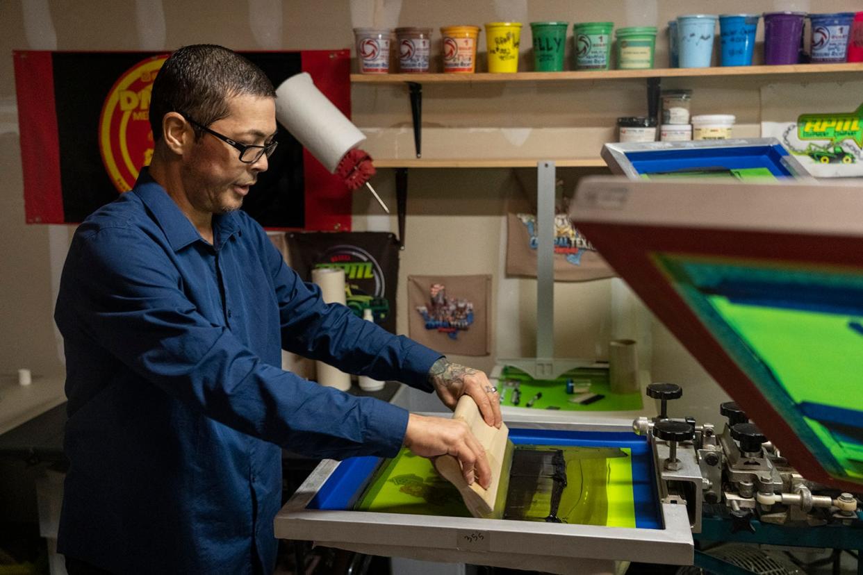 Charles Richard uses his screen printing machine to create a shirt. He has stage 4 lung cancer and isn't able to work now but would like a new printer and laptop to do screen printing between cancer treatments.