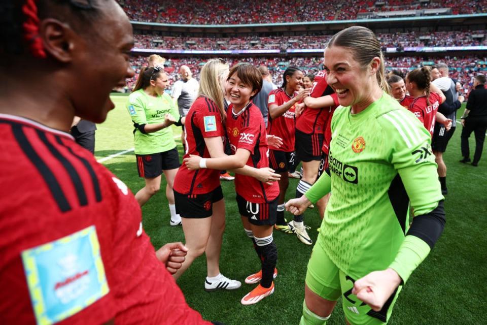 Mary Earps celebrates winning the first honour of her club career  (The FA via Getty Images)