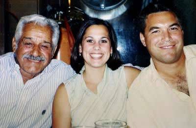 This undated handout photo from the Modesto, Calif., Police Department shows Laci Peterson, center, and her husband, Scott, right. The person on the left is not identified. 