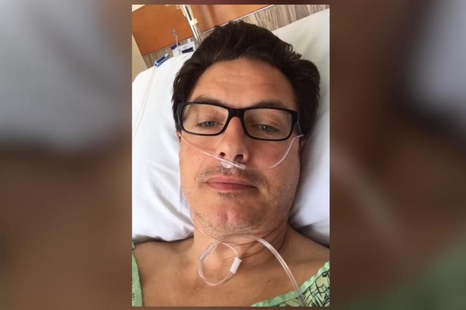 Recovering: John Barrowman in hospital (John Barrowman MBE/Facebook)