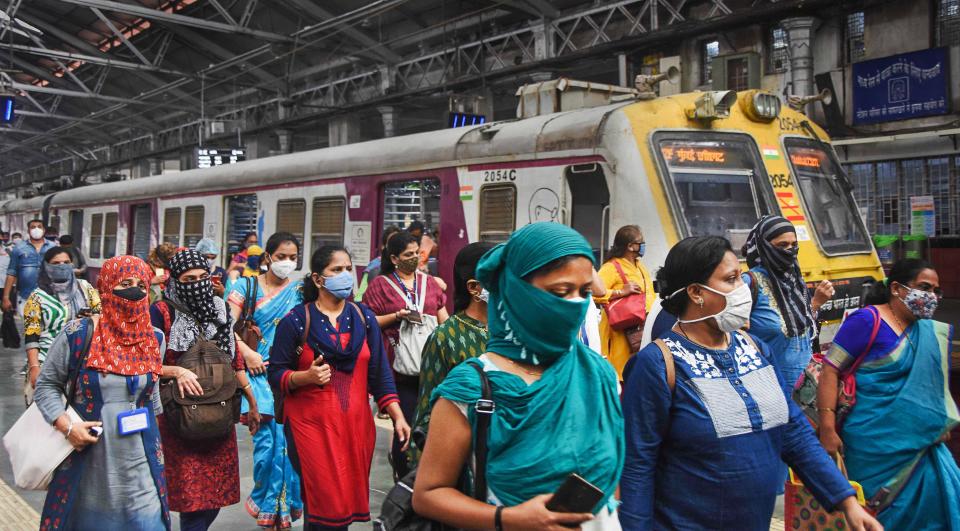 Women passengers deboard a local train after the authorities allowed them to commute during non-peak hours from 11 am to 3 pm and from 7 pm till the end of the service, at CSMT in Mumbai, Wednesday, 21 October, 2020.