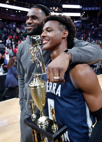 <p>Joe Robbins/Getty</p> LeBron 'Bronny' James Jr. #0 of Sierra Canyon High School with his father LeBron James of the Los Angeles Lakers