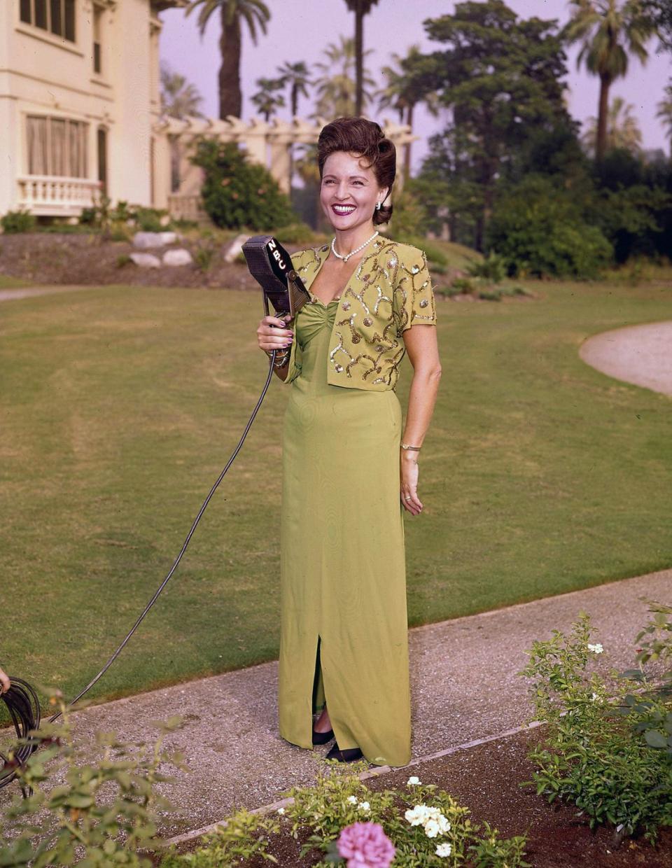 <p>Before venturing into TV, White had her own radio show called "The Betty White Show." Here she is posing with a microphone. </p>