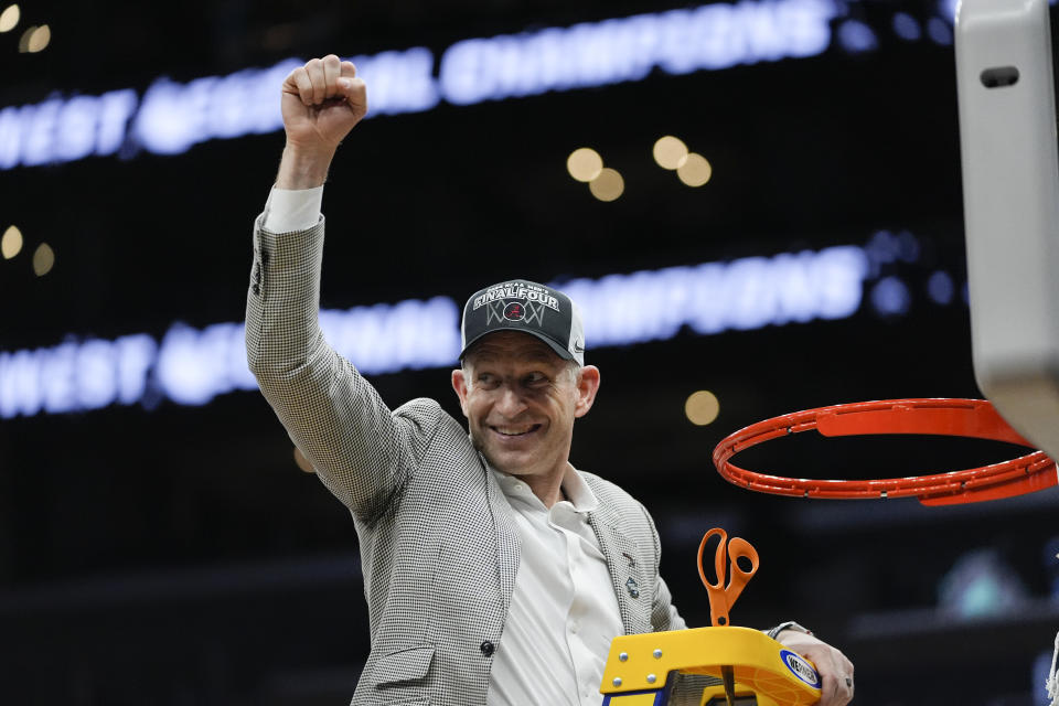 Alabama head coach Nate Oats waves as he cuts down the net after a win over Clemson in an Elite 8 college basketball game in the NCAA tournament Saturday, March 30, 2024, in Los Angeles. (AP Photo/Ryan Sun)