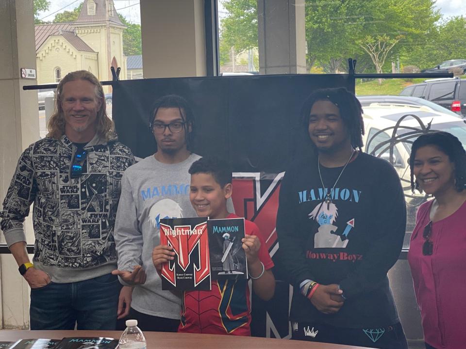 Cousins Kanye and Ryon Conway of Columbia unveil their second graphic novel, titled, “Mammon" at the Maury County Public Library. The Jackson family visits the cousins and grab a copy of their newest work.