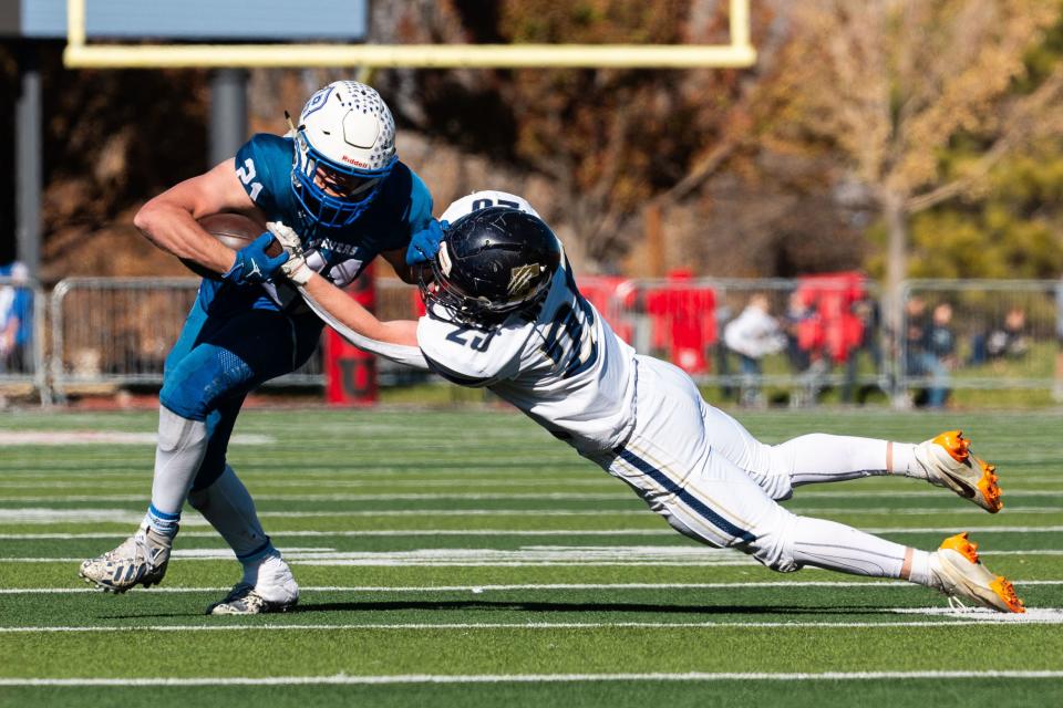 Beaver High School’s Tavyn Hollinghsead is tackled by Enterprise High School’s Jaden Drake in the 1A football state championship at Southern Utah University in Cedar City on Saturday, Nov. 11, 2023. | Megan Nielsen, Deseret News