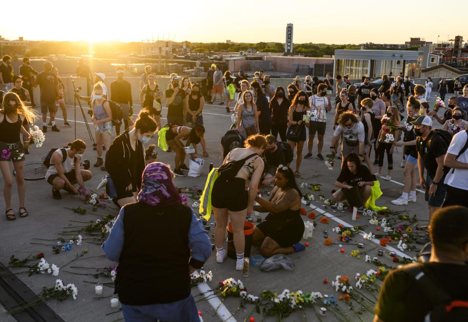 People gather for a vigil at the site where Winston Boogie Smith was killed on June 4, 2021 in Minneapolis, Minnesota. Smith was shot and killed yesterday during an altercation with law enforcement involving multiple agencies. Smith's family is demanding clarity in the case as authorities claim there is no video available from the incident.