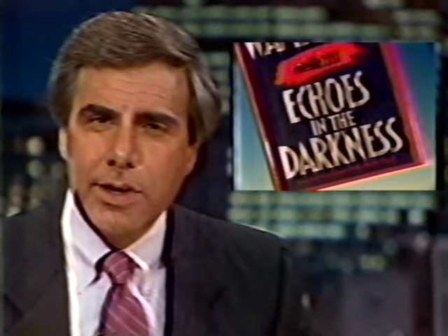 Man in a suit presenting a news segment with a graphic for "Echoes in the Darkness."