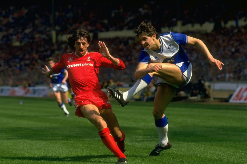 Gary Lineker of Everton shoots past Mark Lawrenson during the FA Cup Final at Wembley Stadium in London. Liverpool won the match 3-1.