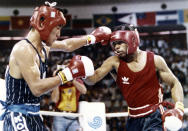 FILE - In this Oct. 2, 1988, file photo, South Korea's Park Si-hun, left, delivers a left jab to America's Roy Jones, and goes on to win the gold medal in the gold medal bout of the light middleweight division at the summer Olympics in Seoul, South Korea. (AP Photo/Ron Kutz, File)