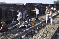 <p>Emergency services rescue victims from overturned train cars near a village in Tekirdag province, Turkey July 8, 2018. (Photo: Mehmet Yirun/DHA-Depo Photos via AP) </p>