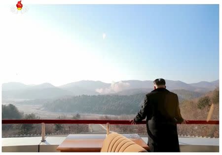 North Korean leader Kim Jong Un watches a long range rocket launched into the air in this still image taken from KRT footage and released by Yonhap on February 7, 2016. REUTERS/Yonhap