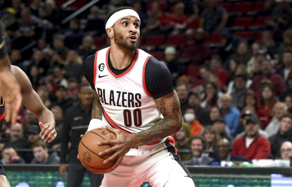 Portland Trail Blazers guard Gary Payton II drives to the basket during the first half of an NBA basketball game against the Detroit Pistons in Portland, Ore., Monday, Jan. 2, 2023. It was Payton's first game of the year after fighting injuries. Payton underwent abdominal surgery in the offseason and initially hoped to be ready for the start of the regular season.The Blazers won 135-106. (AP Photo/Steve Dykes)