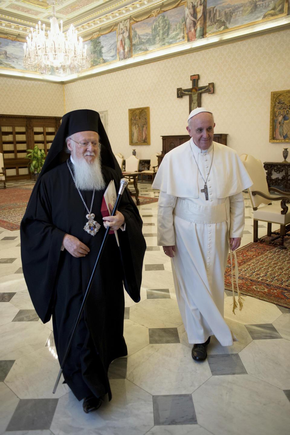 FILE- In this March 20, 2013, file photo provided by the Vatican paper L' Osservatore Romano, Pope Francis, right, meets Bartholomew I, the first ecumenical patriarch to attend the installation of a Pope since the Catholic and Orthodox church split nearly 1,000 years ago, at the Vatican. Bartholomew I, spiritual leader of 250 million Orthodox Christians, said a meeting with Pope Francis in Jerusalem in May 2014, will help move the two churches closer to ending their nearly one-thousand-year divide. (AP Photo/Osservatore Romano, File)