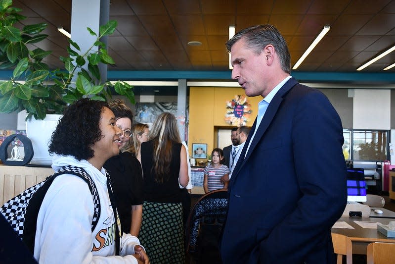 New Mexico Senator Martin Heinrich talks with a Del Norte High School student on Sept. 19, 2023.