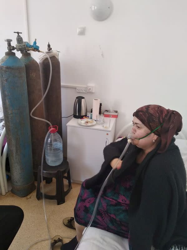 A patient receives oxygen support via a makeshift medical device at a local hospital in Dagestan’s Gurbuki village