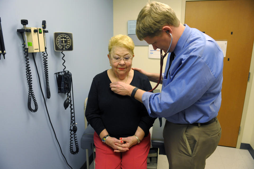 ALEXANDRIA, VA - DECEMBER 17: Family doctor Alex Krist listens to Jane Duncan's heartbeat during her office visit December 17, 2015 in Alexandria, VA.  Krist is part of the volunteer doctor panel,  the  US Preventive Services Task force, that makes recommendations about preventive health services. (Photo by Katherine Frey/The Washington Post via Getty Images)