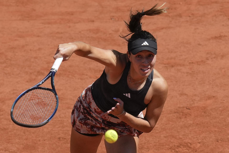 Jessica Pegula of the U.S. serves against Italy's Camilla Giorgi during their second round match of the French Open tennis tournament at the Roland Garros stadium in Paris, Wednesday, May 31, 2023. (AP Photo/Christophe Ena)