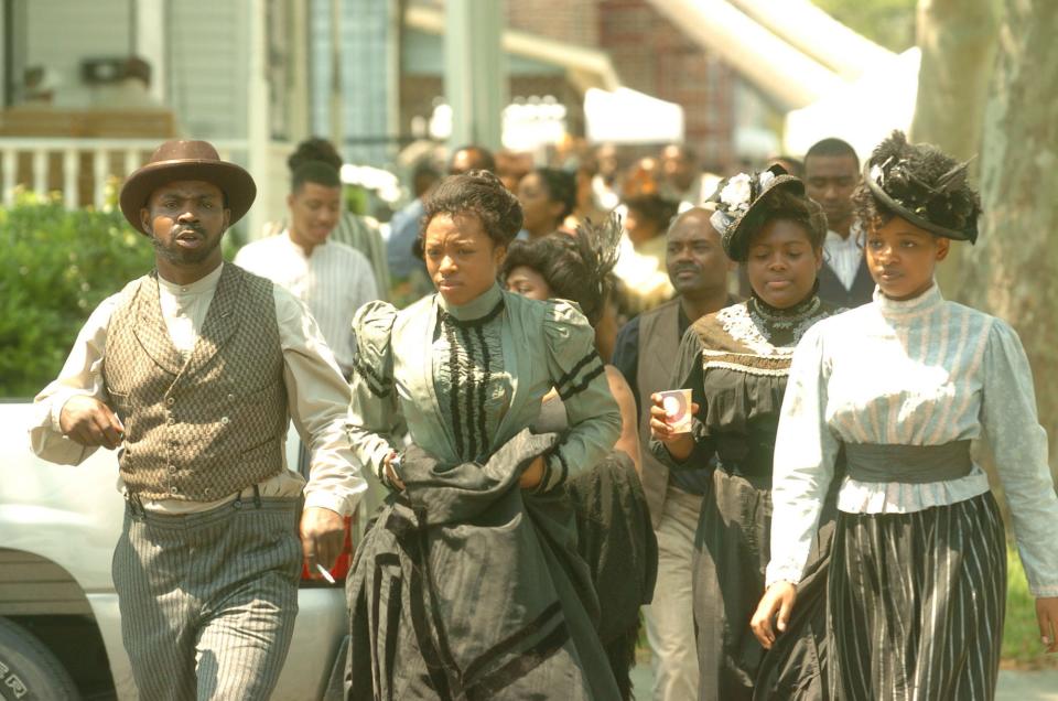 Extras cross 5th Ave. and Campbell St. during a break in the filming of "Bolden" Wednesday, April 25, 2007.