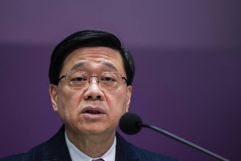 Hong Kong Chief Executive John Lee speaks during a press conference at government headquarters in Hong Kong, Tuesday, Jan. 30, 2024. (AP Photo/Louise Delmotte)