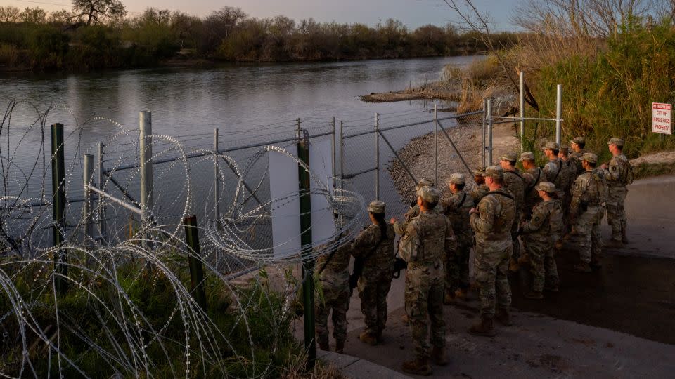 National Guard soldiers stand guard January 12 on the banks of the Rio Grande at Shelby Park in Eagle Pass, Texas. - Brandon Bell/Getty Images