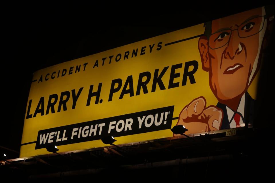 An advertising poster for the real firm Larry H. Parker Accident Attorneys in South Los Angeles.