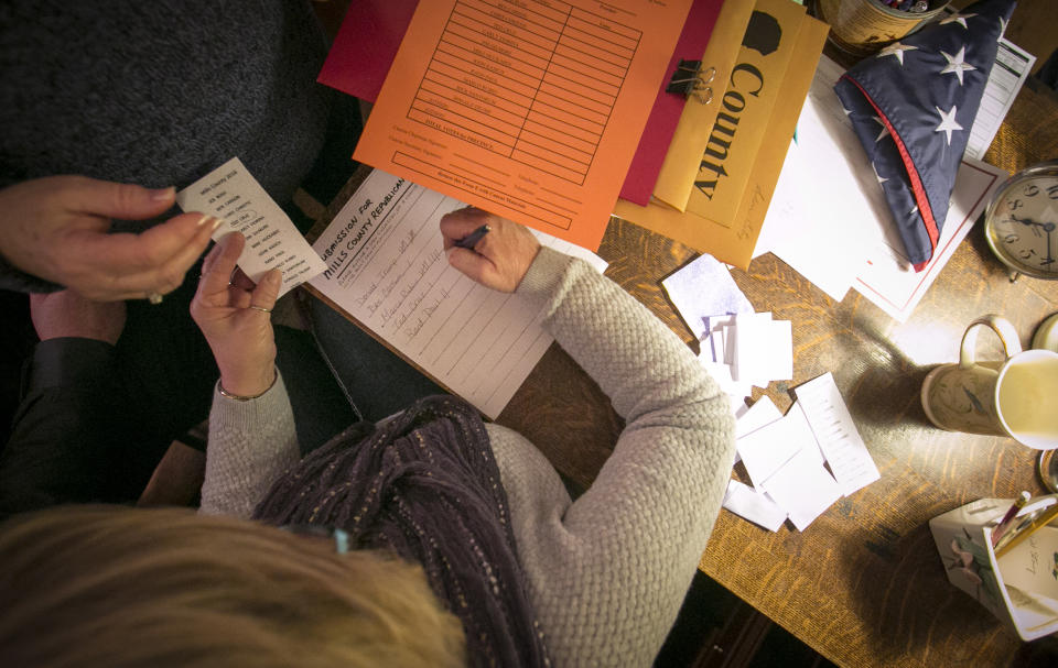 The secretary counts votes at a caucus site Monday, Feb 1, 2016, in Silver City, Iowa.  (AP Photo/Dave Weaver)