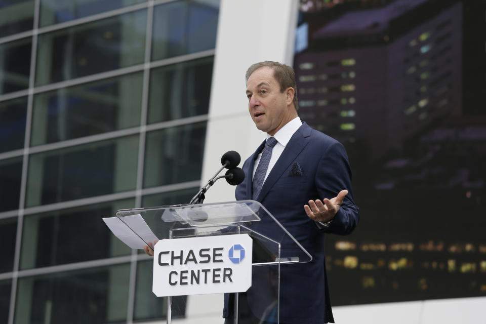 Joe Lacob at a Chase Center podium. 