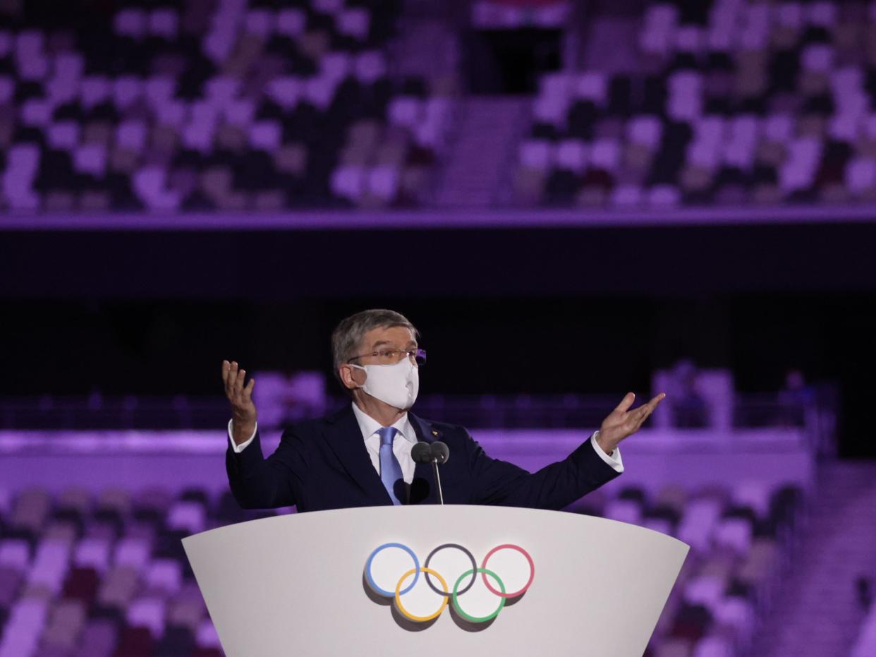 International Olympic Committee (IOC) President Thomas Bach wearing a protective face mask speaks during the opening ceremony. (REUTERS)