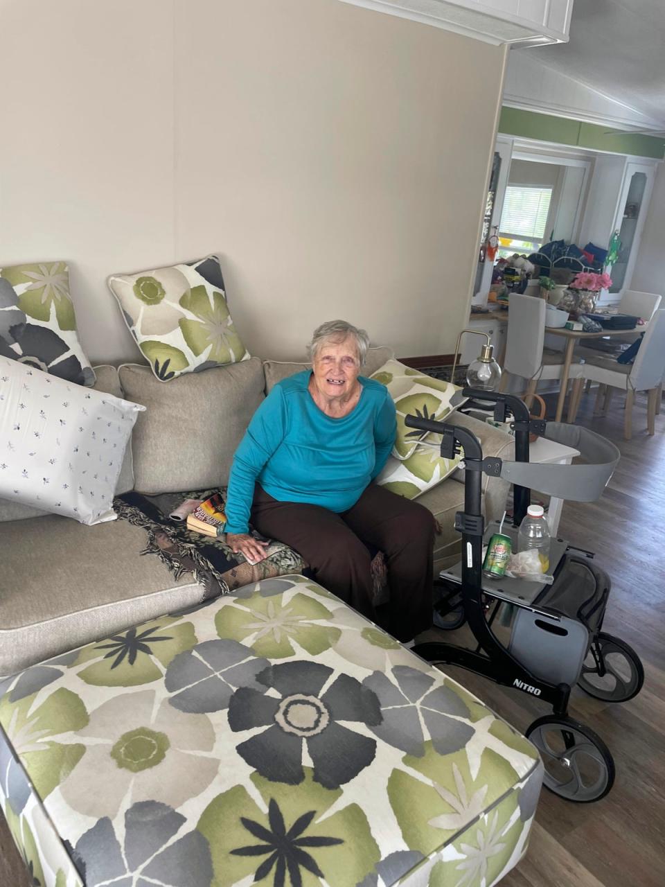 In this photo provided by Cheynne Prevatt, Shirley Affolter is found safe and dry at her home in Englewood, Fla., by Good Samaritan Prevatt, Thursday, Sept. 29, 2022 (Cheynne Prevatt via AP)