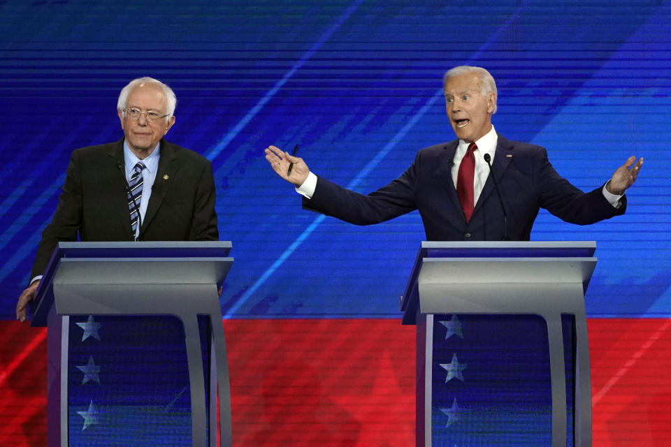 Sen. Bernie Sanders, I-Vt., left, listens as former Vice President Joe Biden, right, speaks Thursday, Sept. 12, 2019, during a Democratic presidential primary debate hosted by ABC at Texas Southern University in Houston. (AP Photo/David J. Phillip)