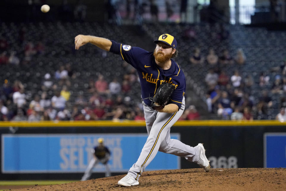 Milwaukee Brewers starting pitcher Brandon Woodruff throws against the Arizona Diamondbacks during the fourth inning of a baseball game, Wednesday, June 23, 2021, in Phoenix. (AP Photo/Matt York)