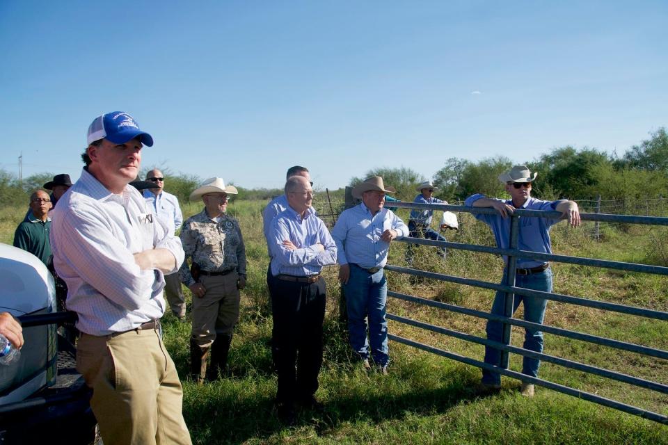 USDA Undersecretary for Farm Production and Conservation Robert Bonnie (left front) visits Los Hermanos Ranch in Brooks County to hear about the work of Texas A&M University-Kingsville researchers in reducing the emissions of cattle ranches on Dec. 15, 2022.