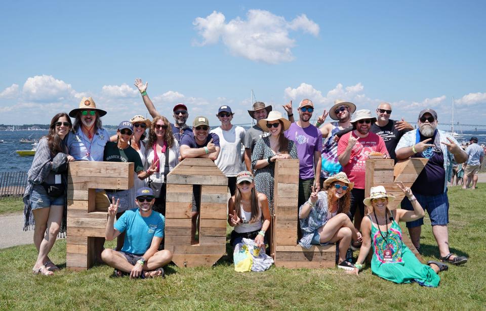 Newport Folk Festival attendees pose for a photo at Fort Adams State Park.