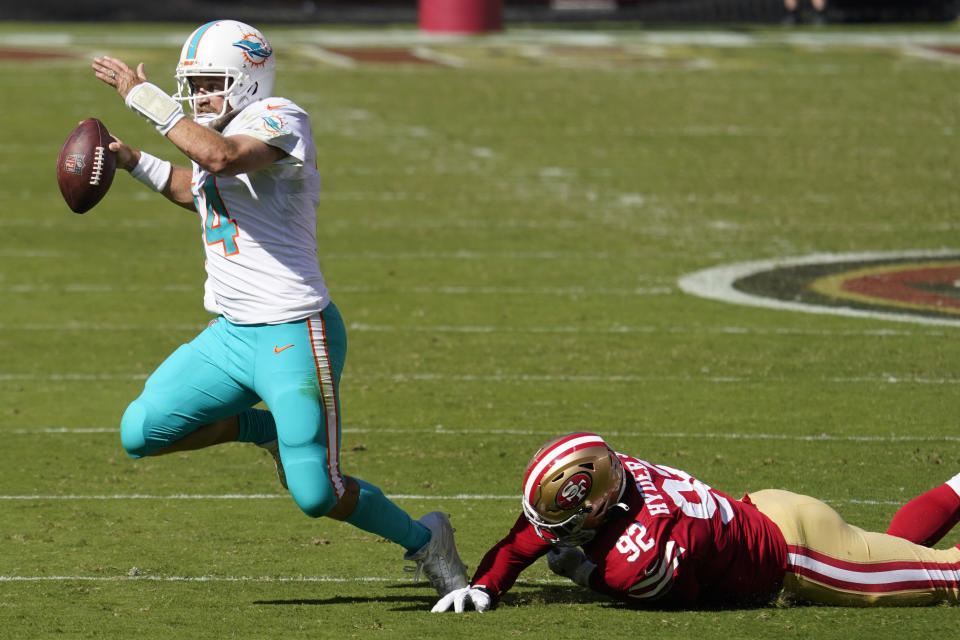 San Francisco 49ers defensive end Kerry Hyder Jr. (92) sacks Miami Dolphins quarterback Ryan Fitzpatrick (14) during the first half of an NFL football game in Santa Clara, Calif., Sunday, Oct. 11, 2020. (AP Photo/Tony Avelar)