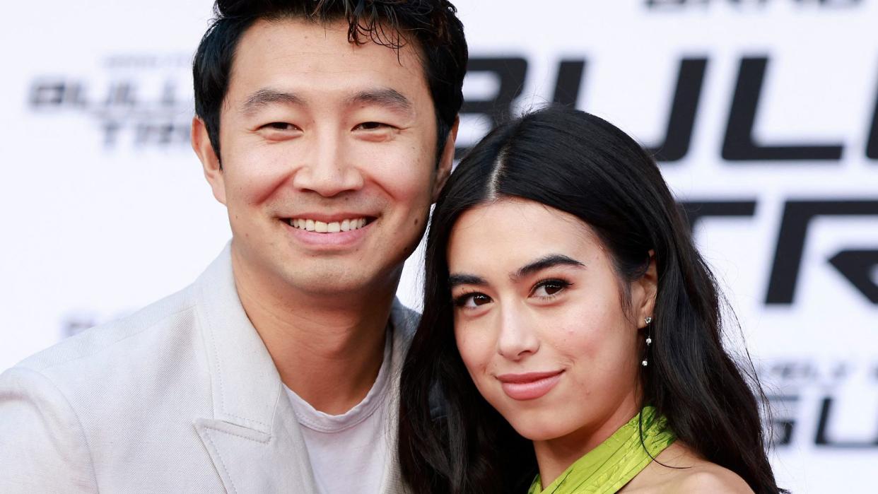 Canadian actor Simu Liu and actress Jade Bender attend the Los Angeles premiere of "Bullet Train" at the Regency Village theatre in Westwood, California, August 1, 2022