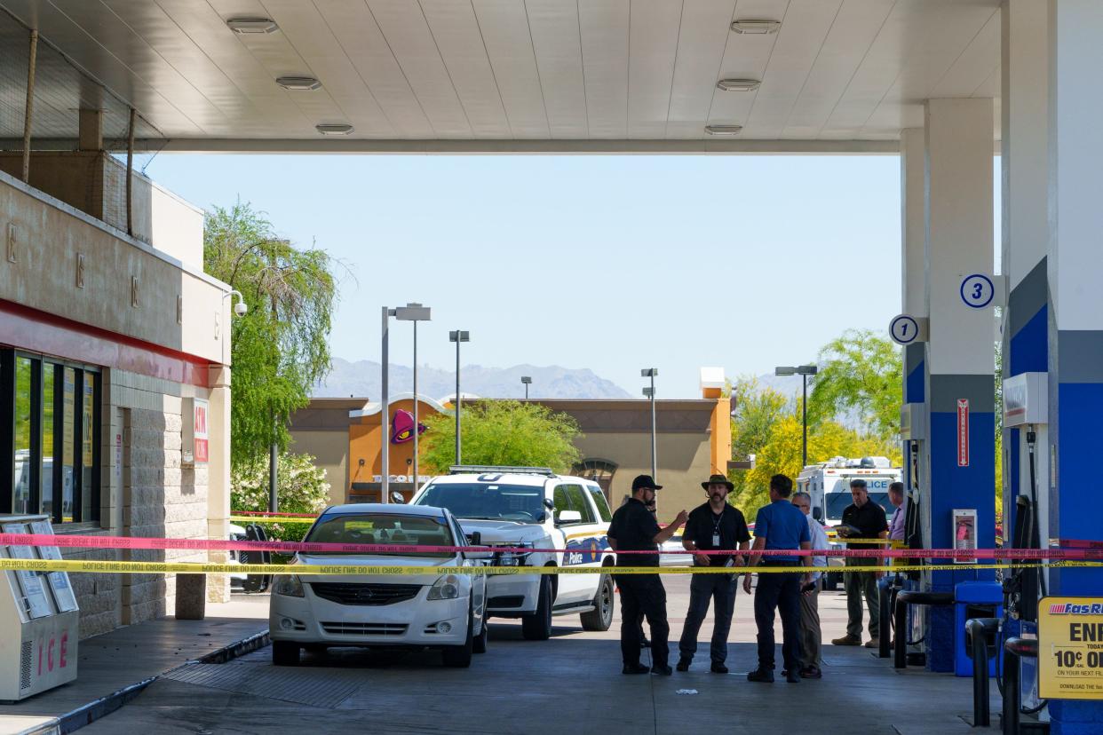 Phoenix Police Department officers at the scene of an officer-involved shooting at a gas station on the corner of Cave Creek and Beardsley roads on April 14, 2022, in Phoenix.