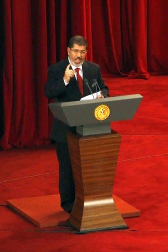 President Mohamed Morsi delivers a speech at Cairo's University after being sworn-in at the Constitutional Court in Cairo. Morsi pointedly mentioned the "elected parliament" several times and said the army should resume its normal role