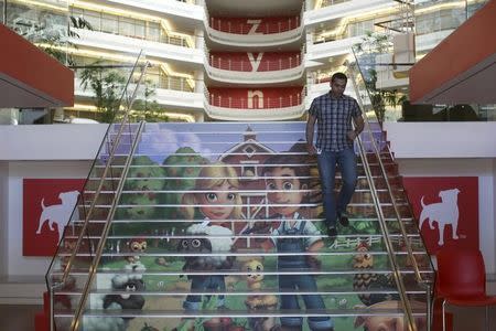 Player avatars from Zynga's FarmVille 2 are seen on a stairway at the entrance to Zynga headquarters in San Francisco, California April 23, 2013. REUTERS/Robert Galbraith