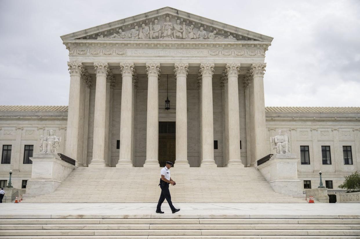 <span class="caption">The U.S. Supreme Court has allowed Texas' abortion restrictions to take effect.</span> <span class="attribution"><a class="link " href="https://www.gettyimages.com/detail/news-photo/supreme-court-police-officer-patrols-at-the-u-s-supreme-news-photo/1234993989?adppopup=true" rel="nofollow noopener" target="_blank" data-ylk="slk:Drew Angerer/Getty Images;elm:context_link;itc:0;sec:content-canvas">Drew Angerer/Getty Images</a></span>