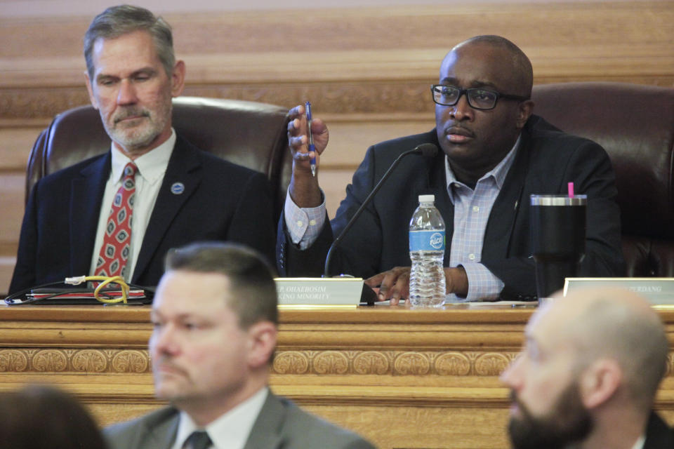 Kansas state Rep. K.C. Ohaebosim, right, D-Wichita, asks a question during a hearing on a December oil spill from the Keystone pipeline system in Washington County, during a joint meeting of two House committees, Tuesday, March 14, 2023, at the Statehouse in Topeka, Kan. Democrats asked pointed questions of a vice president for Keystone operator TC Energy. (AP Photo/John Hanna)