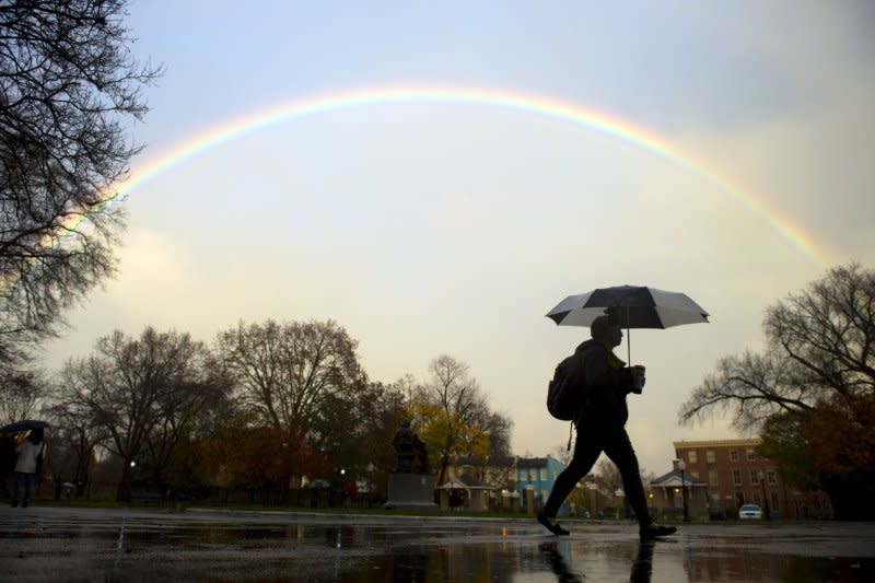 A rainbow is seen over a woman as she walks through Georgetown University's campus in Washington, D.C., on November 19, 2015. On November 15, 1791, Georgetown University opened as the first Roman Catholic college in the United States. File Photo by Kevin Dietsch/UPI