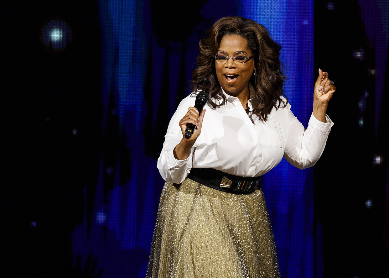 A photo of Oprah Winfrey speaking onstage.
