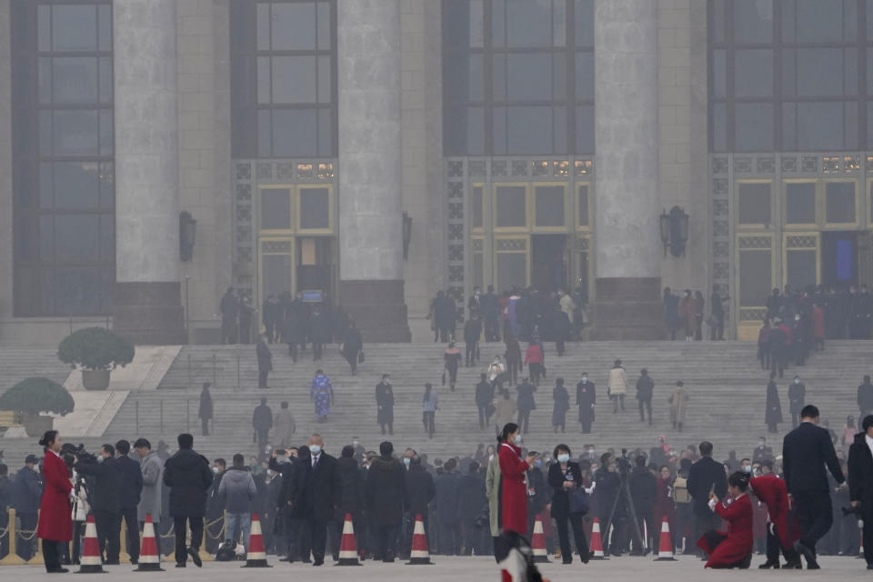 Delegates arrive at the Great Hall of the People for the opening session of the annual National People's Congress held in Beijing on Friday, March 5, 2021. The ruling Communist Party is aiming for economic growth "over 6%" as it rebounds from the coronavirus pandemic, Premier Li Keqiang said in a speech at China's ceremonial legislature Friday. (AP Photo/Ng Han Guan)