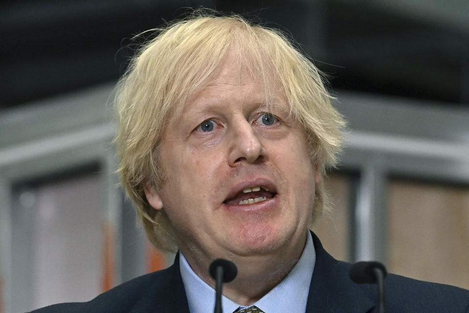 FILE - In this June 30, 2020, file photo, Britain's Prime Minister Boris Johnson delivers a speech during a visit to Dudley College of Technology in Dudley, England. From Tokyo to Brussels, political leaders have swiftly decried Beijing's move to impose a tough national security law on Hong Kong that cracks down on subversive activity and protest in the semi-autonomous territory. But the rhetoric from democratic nations has more bark than bite. (Paul Ellis/Pool Photo via AP, File)