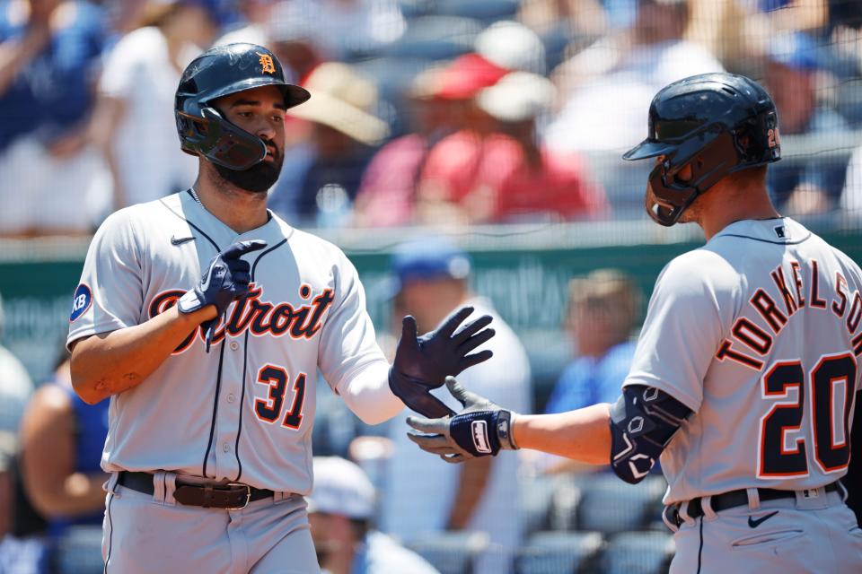 Tigers' Riley Greene (31) is congratulated by Spencer Torkelson after scoring off a sacrifice fly by Harold Castro (not pictured) during the first inning Wednesday, July 13, 2022 in Kansas City, Mo.