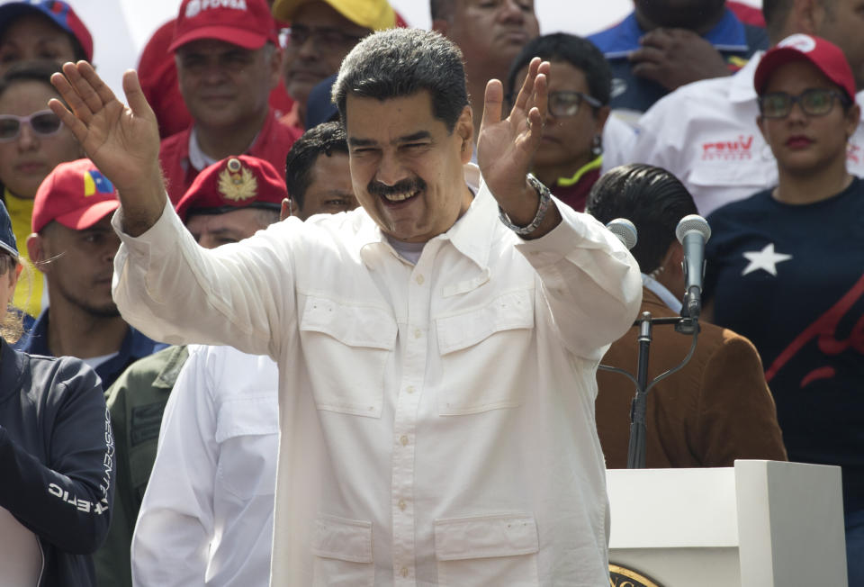 Venezuela's President Nicolas Maduro acknowledges supporters during a government rally in Caracas, Venezuela, Saturday, March 9, 2019. Demonstrators danced and waved flags on what organizers labeled a “day of anti-imperialism” in a show of defiance toward the United States, which has imposed oil sanctions on Venezuela in an attempt to oust the president. (AP Photo/Ariana Cubillos)